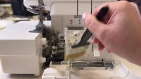 Master clean the overlock sewing machine from dust Stock Footage 306278146