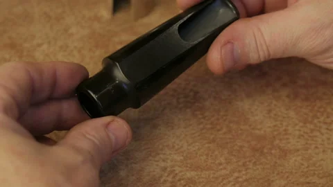 Master Cleans And Repairs The Saxophone Stock Footage 147976015
