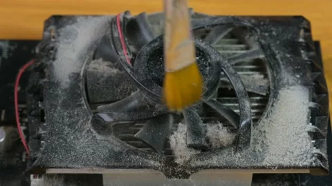 The master cleans the cooler on the video card close-up with a brush. Stock Footage 133340965