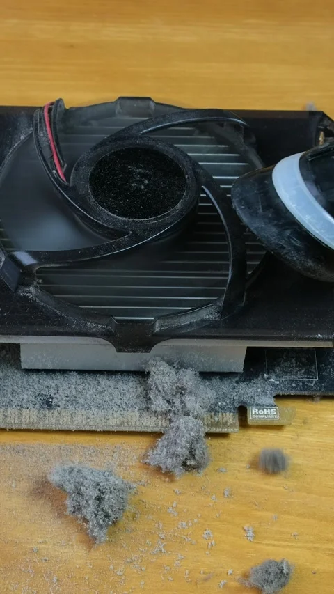 The master cleans the cooler on the video card with a vacuum cleaner. Hand .. Stock Footage 291949732