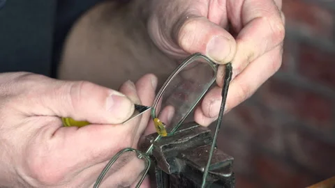 Master cleans old glasses with a blade 4K Stock-Footage 150286863