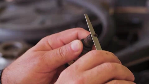The master cleans the spark plug Stock Footage 246995227