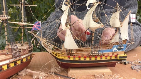 The master collects a model of a sailing ship. Video stock 117267733