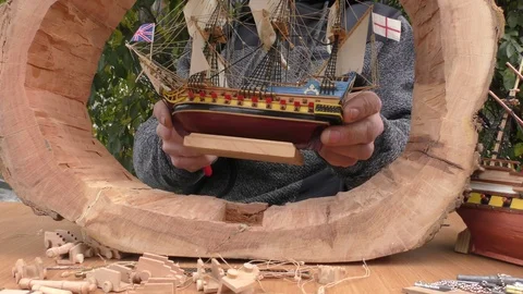 The master collects a model of a sailing ship. Stock Footage 117284232