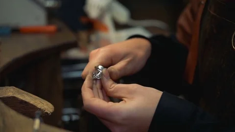 Master completes making the ring and proceeds to the final stage of polishing Stock Footage 73813570