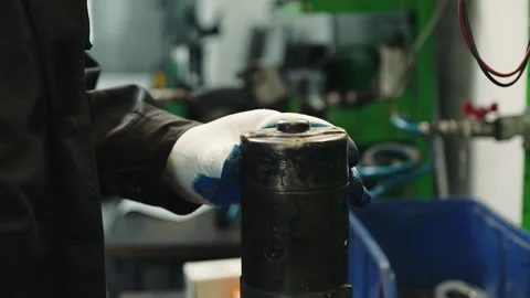 The master completes the repair of the car starter unit and installs a Stock Footage 285641085
