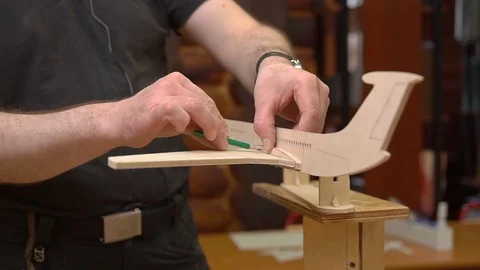 Master connects soviet aircraft model fuselage with wing Stock Footage 126895783