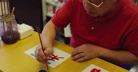 A master craftsman and painter of bus signs in Hong Kong. Shot on red, hand held Stock Footage 201096023