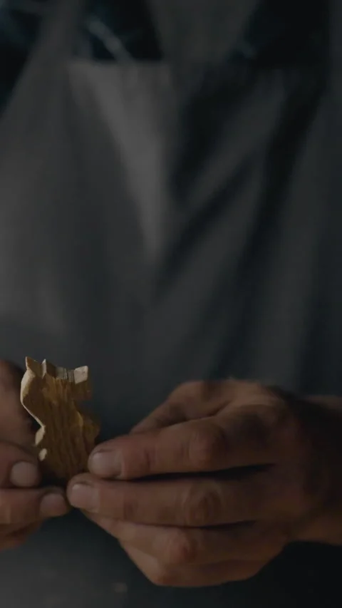 Master craftsman shaping custom chess pieces in a detailed woodworking works Stock Footage 331644584
