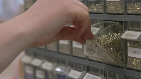 Master Craftswoman Retrieves Tiny Part from Drawer to Assemble product skillful Stock Footage 161800339