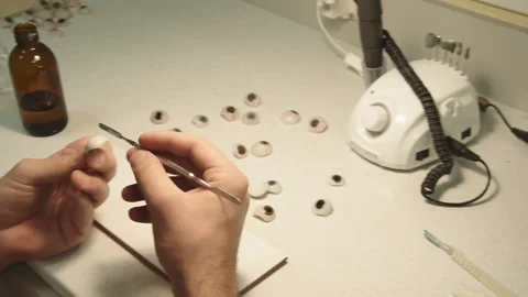 The master creates an eye prosthesis Stock Footage 157508148