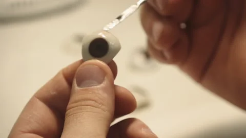 The master creates an eye prosthesis Stock Footage 157508150
