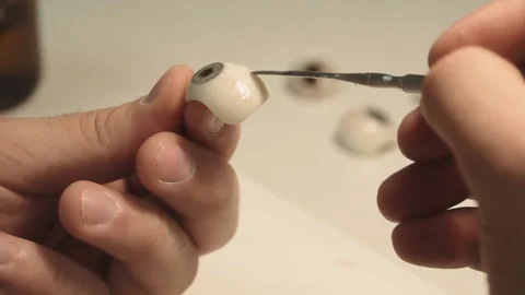 The master creates an eye prosthesis Stock Footage 157508161