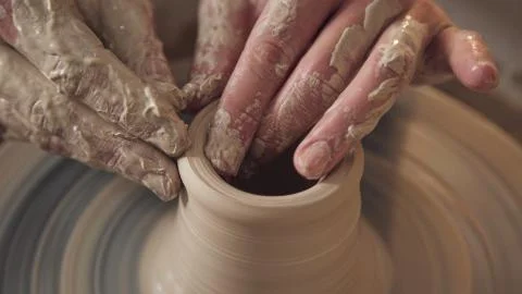 Master crock at the creative process in studio. Forming of the body. Stock Photos