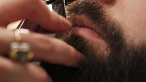 The master cuts a man's mustache Stock Footage 157621699