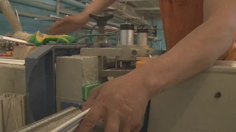 The master cuts the profile, using special saws Stock Footage 75156276