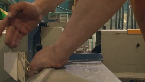 The master cuts the profile, using special saws Stock Footage 75156415