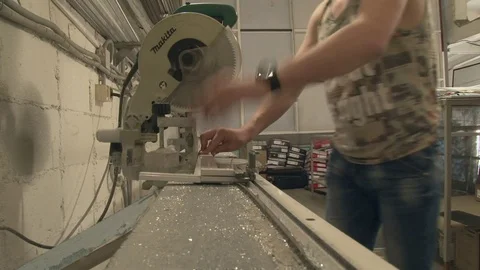 The master cuts the profile, using special saws Stock Footage 75157116