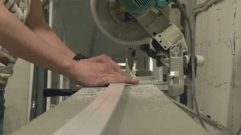 The master cuts the profile, using special saws Stock Footage 75157158