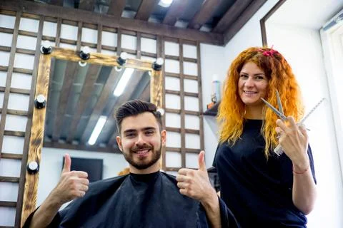 Master cutting hair Stock Photos