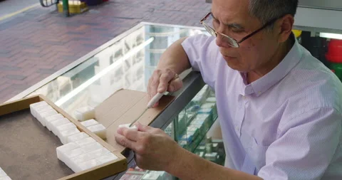 A master demonstrates making a Mahjong tile game (played among the old people) Stock Footage 201095518