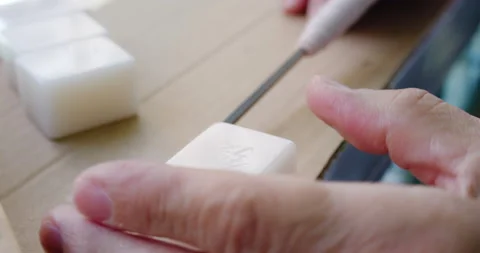 A master demonstrates making a Mahjong tile game (played among the old people) Stock Footage 201096575