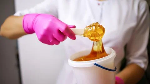 Master of depilation sugaring Stock Photos