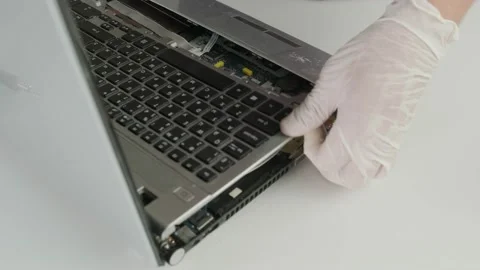 The master disassembles  the laptop case for  repair. Laptop repair.  Stock Footage 158577507