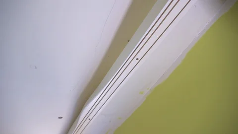 Master dismantles holder for installation of suspended ceilings. Stock Footage 127493366