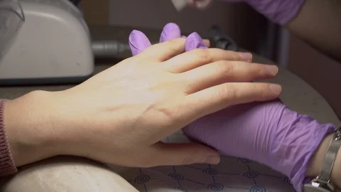 The master does hardware manicure in the beauty salon. Close-up. Stock Footage 102536660