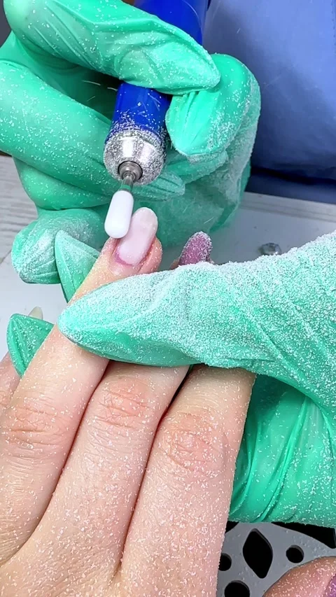 The master does hardware manicure in the beauty salon. Removal of the gel  Stock Footage 294331982
