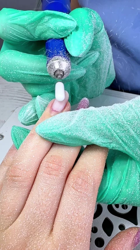 The master does hardware manicure in the beauty salon. Removal of the gel  Stock Footage 294332060