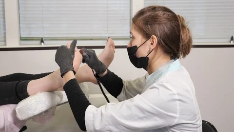 Master does hardware pedicure. Beauty Salon Services Stock Footage 127596183