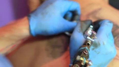 The master does the tattoo Stock Footage 78595376