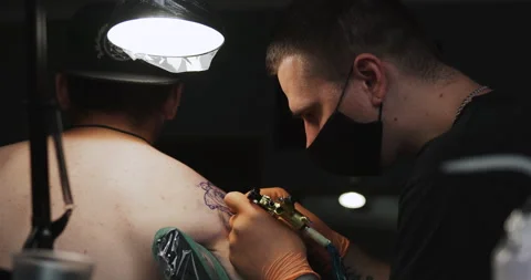 Master Doing Tattooing In Tattoo Studio. Stock Footage 133536483