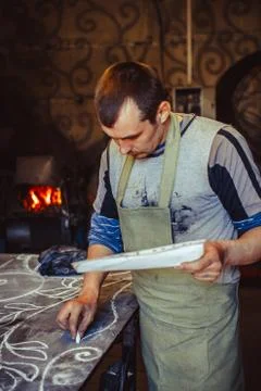 The master draws on the table Stock Photos