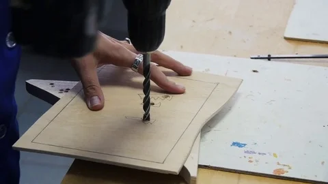 The master drill a hole in the wood Stock Footage 79408966