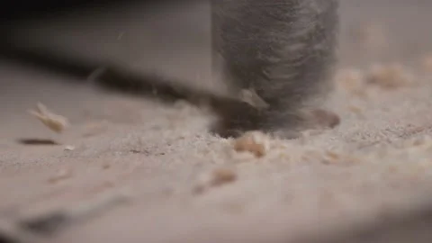 Master drills a hole in the Board Stock Footage 130698557