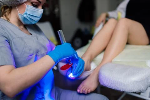 Master during a pedicure. The process of professional pedicures. The concept  Stock Photos