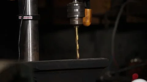 A master engineer is drilling steal on a drilling machine Stock Footage 237155686