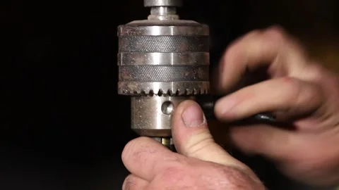 A master engineer is drilling steal on a drilling machine Stock Footage 237155729