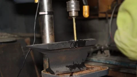 A master engineer is drilling steal on a drilling machine Stock Footage 237155817