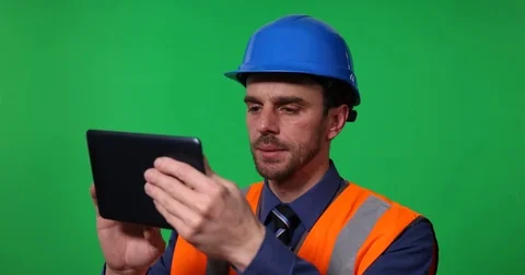 Master Engineer Male Analyzing Modern Work Technology Browsing a Digital Tablet Stock Footage 77005918