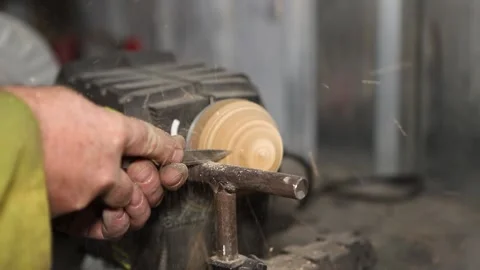 A master engineer processes a wooden detail on a machine tool Stock Footage 237156155