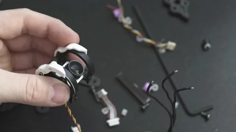 Master examines the camera from the FPV drone in his hands Stock Footage 149774168