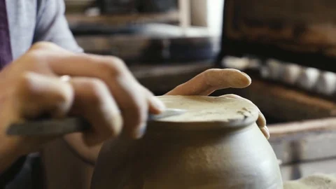 The master finishes the work of the clay kettle Stock Footage 87496695