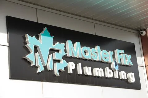 Master fix plumbing mf rectangle horizontal sign logo with maple leaf on front Stock Photos