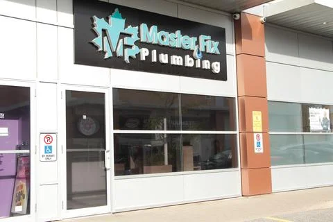 Master fix plumbing mf store with rectangle horizontal sign logo with maple leaf Stock Photos