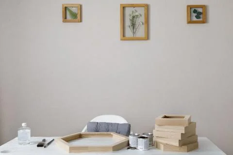 Master of the frame of flowers. Framing dried plants. Stock Photos