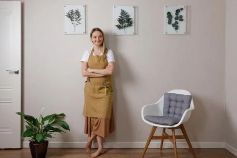 Master of the frame of flowers. Framing dried plants. Stock Photos